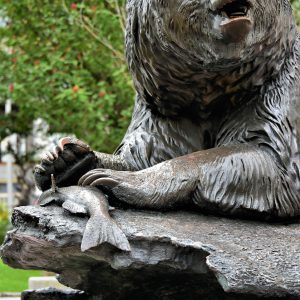 Brown Bear with Salmon Sculpture in Juneau, Alaska - Encircle Photos
