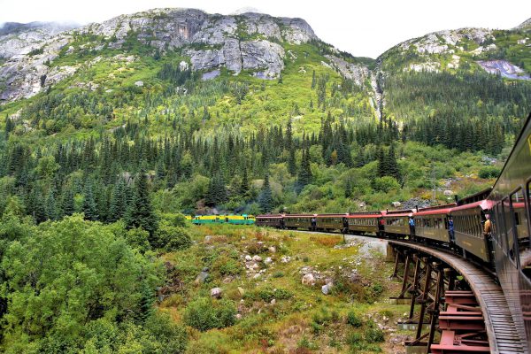 Train Turning through Coastal Mountains in Skagway, Alaska - Encircle Photos