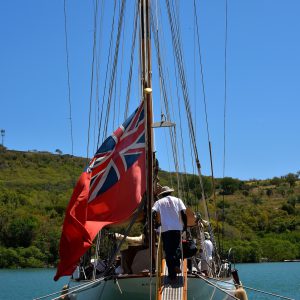 Sailboat with UK Red Ensign Flag in English Harbour, Antigua - Encircle Photos