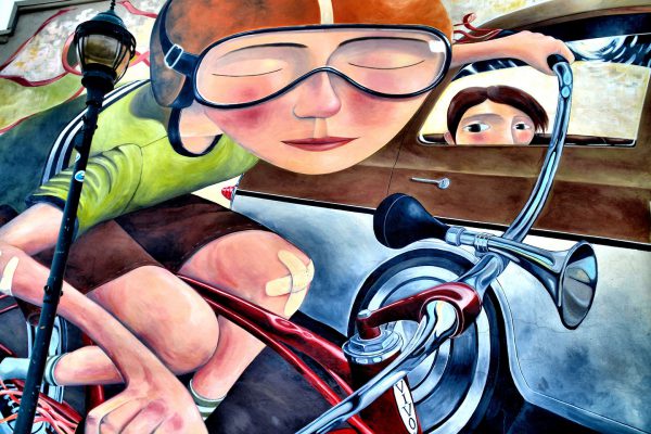 Bicyclist with a Band-Aid Mural on Absolute Bikes by Lyle Motley in Flagstaff, Arizona - Encircle Photos