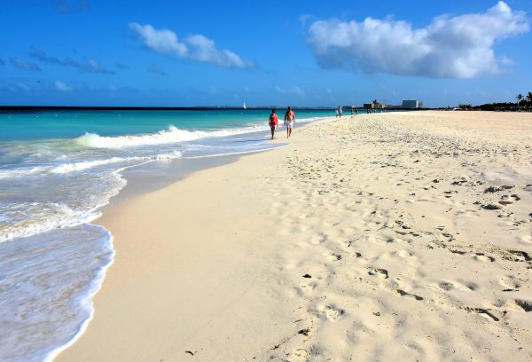 Couple Strolling Manchebo Beach near Oranjestad, Aruba - Encircle Photos