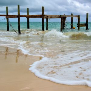 Damaged Pier at Taino Beach in Freeport, Bahamas - Encircle Photos