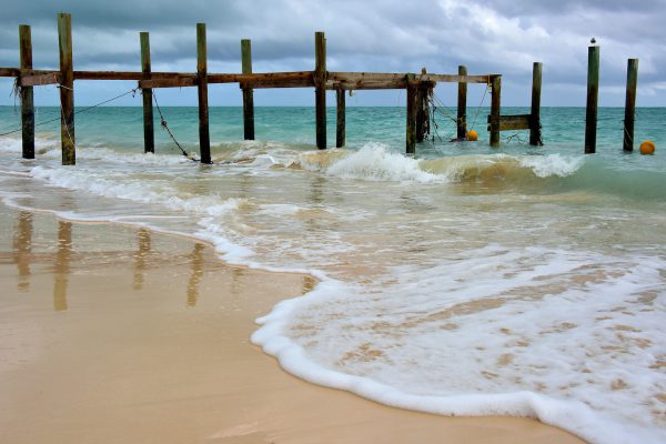 Damaged Pier at Taino Beach in Freeport, Bahamas - Encircle Photos