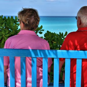 Couple Enjoying View from Bench at Half Moon Cay, The Bahamas - Encircle Photos