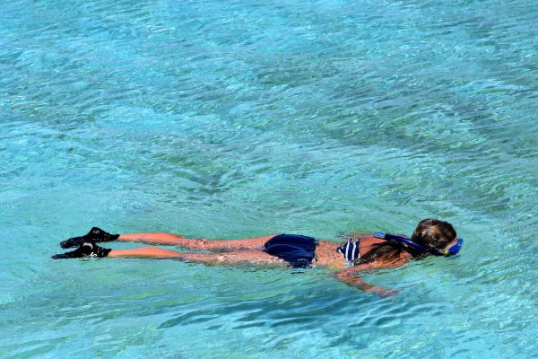 Woman Snorkeling in Lagoon at Half Moon Cay, The Bahamas - Encircle Photos
