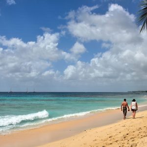 Couple Strolling at Paynes Bay Beach in Saint James Parish, Barbados - Encircle Photos