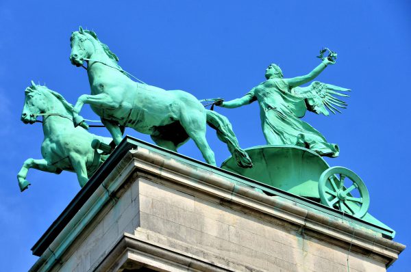 Statue of Winged Pheme Riding Chariot in Antwerp, Belgium - Encircle Photos