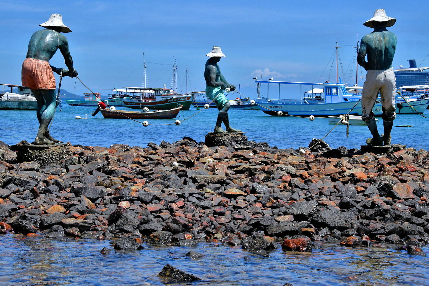 Three Fishermen Statues in Búzios, Brazil Encircle Photos