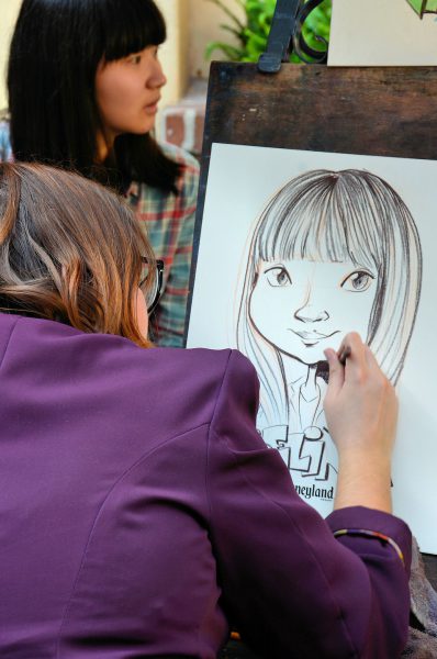 Caricature Artist in New Orleans Square at Disneyland in Anaheim, California - Encircle Photos