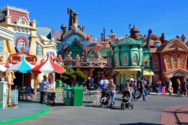 Parents Pushing Strollers in Mickey’s Toontown at Disneyland in Anaheim, California - Encircle Photos