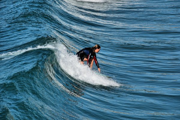 Woman Surfer Riding a Wave in San Clemente, California - Encircle Photos