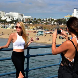 Girls Taking Photo on Santa Monica Pier in Santa Monica, California - Encircle Photos