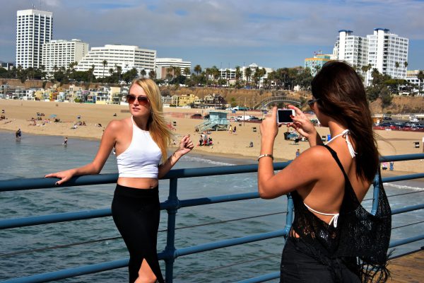 Girls Taking Photo on Santa Monica Pier in Santa Monica, California - Encircle Photos