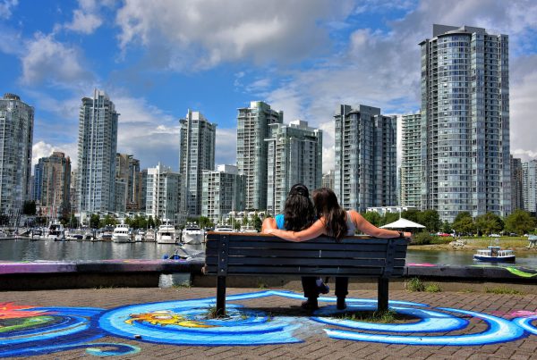 Romantic Couple on Bench Viewing Downtown Vancouver, Canada - Encircle Photos