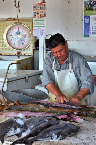 Merchant Fileting Fish at Fish Market in Arica, Chile - Encircle Photos