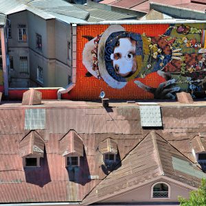 Sideways Ekeko Mural by INTI in Valparaíso, Chile - Encircle Photos