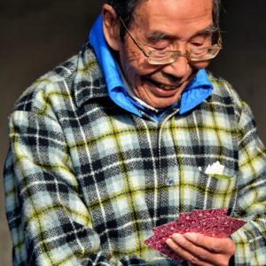 Man Playing Cards at Long Corridor at Temple of Heaven in Beijing, China - Encircle Photos