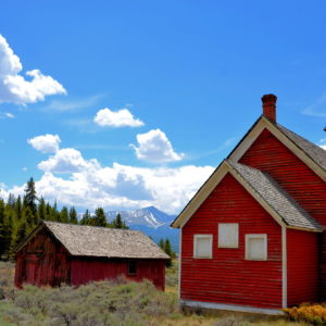 Old Malta Little Red Schoolhouse and Rocky Mountains near Leadville, Colorado - Encircle Photos