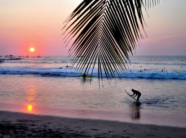 Surfing at Sunset on Playa Tamarindo, Costa Rica - Encircle Photos