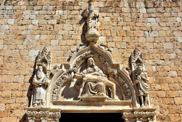 Pietà Carving on Little Brothers Church Door in Dubrovnik, Croatia - Encircle Photos