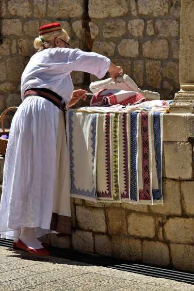 Woman Selling Embroidery in Dubrovnik, Croatia - Encircle Photos