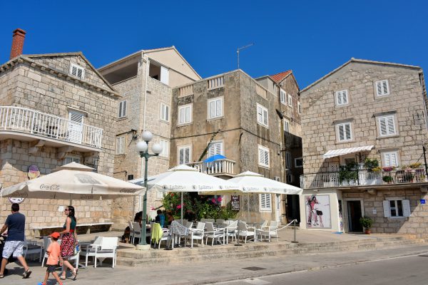 Family Walking Towards Plokata Square in Korčula, Croatia - Encircle Photos