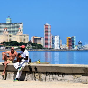 Musicians Socializing along Malecón in Havana, Cuba - Encircle Photos