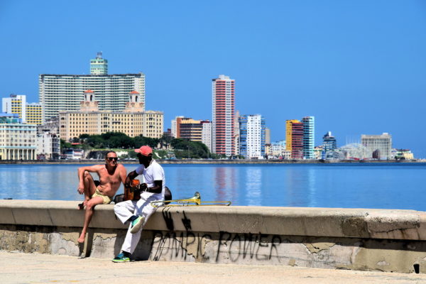 Musicians Socializing along Malecón in Havana, Cuba - Encircle Photos