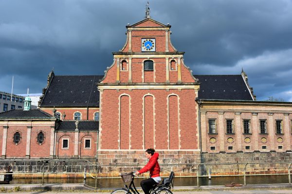 Cyclist in Front of Holmens Kirke in Copenhagen, Denmark - Encircle Photos