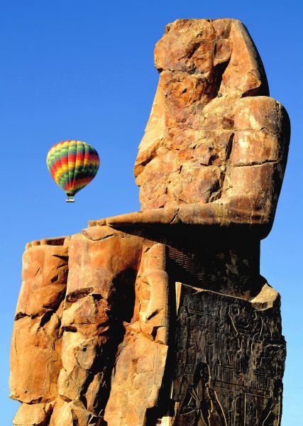 Colossi of Memnon Statue of Amenhotep III with Hot Air Balloon near Luxor, Egypt - Encircle Photos