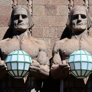 Stone Men Statues at Entry of Central Railway Station in Helsinki, Finland - Encircle Photos