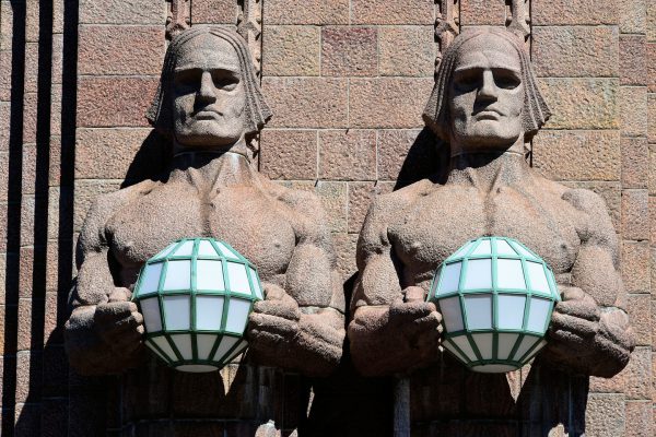 Stone Men Statues at Entry of Central Railway Station in Helsinki, Finland - Encircle Photos