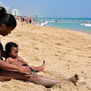 Mother with Baby Playing in Sand in Fort Lauderdale, Florida - Encircle Photos
