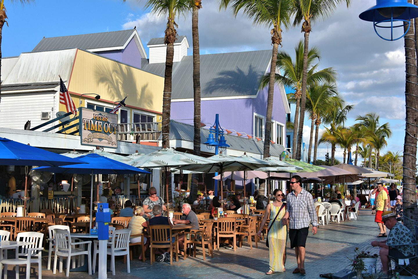 Couple Walking in Times Square at Fort Myers Beach, Florida Encircle