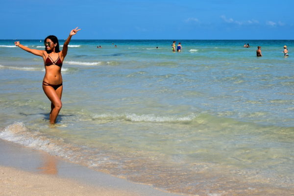 Young Woman Striking Pose at South Beach in Miami Beach, Florida - Encircle Photos