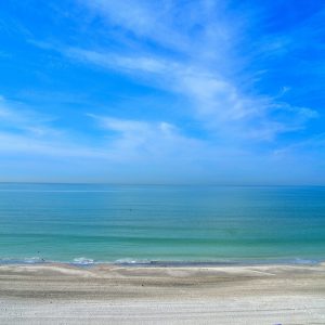 Blue Sun Umbrellas along Gulf in North Redington Beach in Florida - Encircle Photos