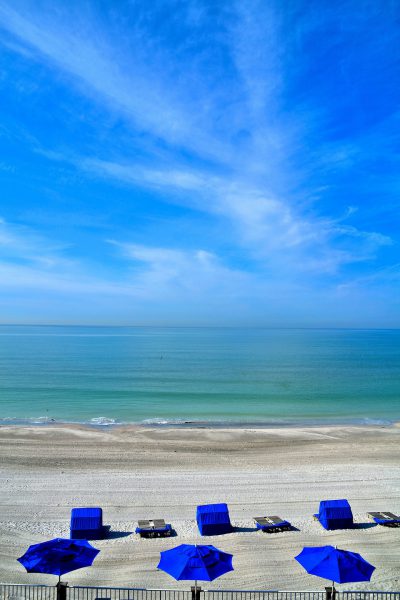 Blue Sun Umbrellas along Gulf in North Redington Beach in Florida - Encircle Photos