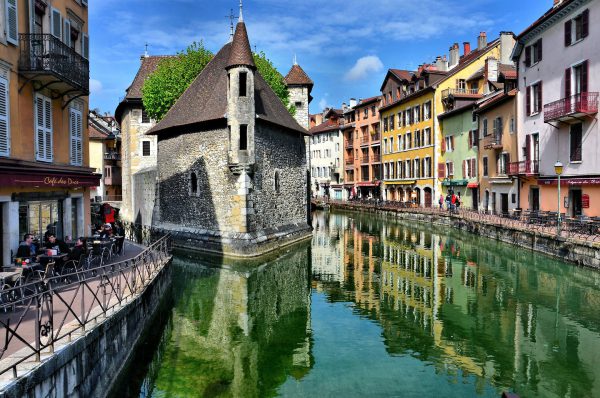 Palais de I’Isle Reflecting in Thiou Canal in Annecy, France - Encircle Photos