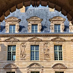 Hôtel de Sully Courtyard through Arch in Paris, France - Encircle Photos