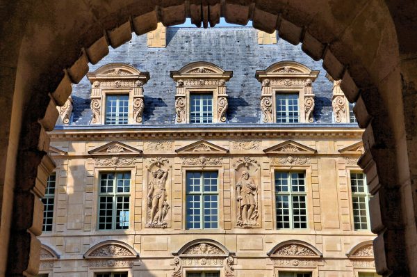 Hôtel de Sully Courtyard through Arch in Paris, France - Encircle Photos