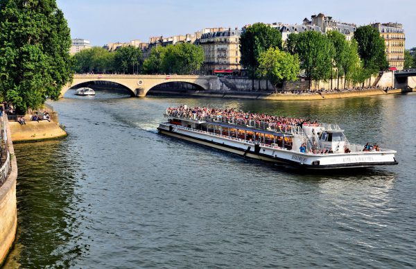 Tourist Boat on Seine from Pont d’Arcole Bridge in Paris, France - Encircle Photos