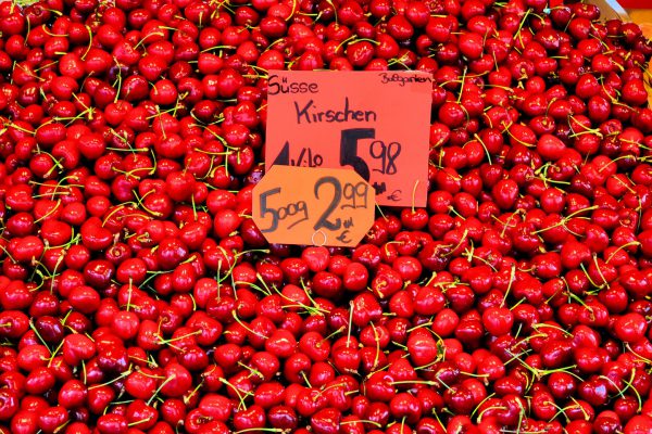 Large Display of Red Sweet Cherries at Viktualienmarkt in Munich, Germany - Encircle Photos