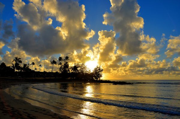 Sunrise at Po’ipū Beach at Po’ipū on Kaua’i, Hawaii - Encircle Photos