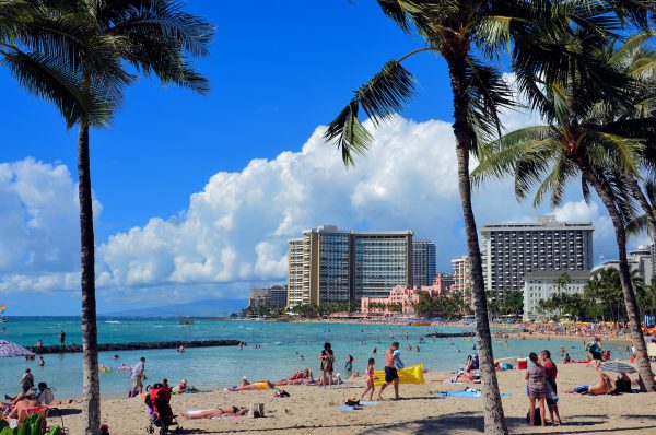 Crowd Sunning at Prince Kūhiō Beach at Waikīkī in Honolulu, O’ahu, Hawaii - Encircle Photos