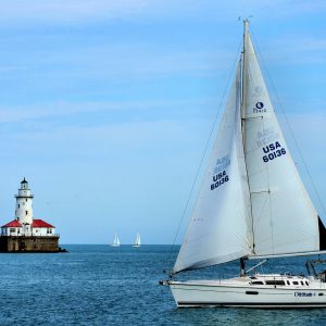Chicago Harbor Light and Sailboat in Chicago, Illinois - Encircle Photos