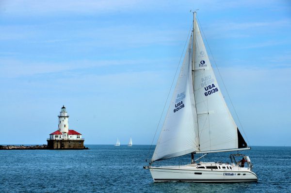 Chicago Harbor Light and Sailboat in Chicago, Illinois - Encircle Photos