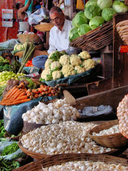 Vendor at Vegetable Stand at Street Market in Mumbai, India - Encircle Photos
