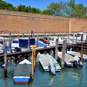 Brick Wall, Bell Tower and Moored Boats in Venice, Italy - Encircle Photos