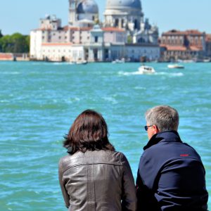 Middle-aged Couple Viewing Santa Maria della Salute in Venice, Italy - Encircle Photos