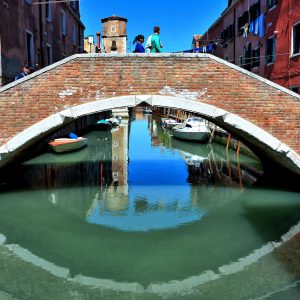 Ponte Nuovo Bridge Reflecting in Canal Water in Venice, Italy - Encircle Photos
